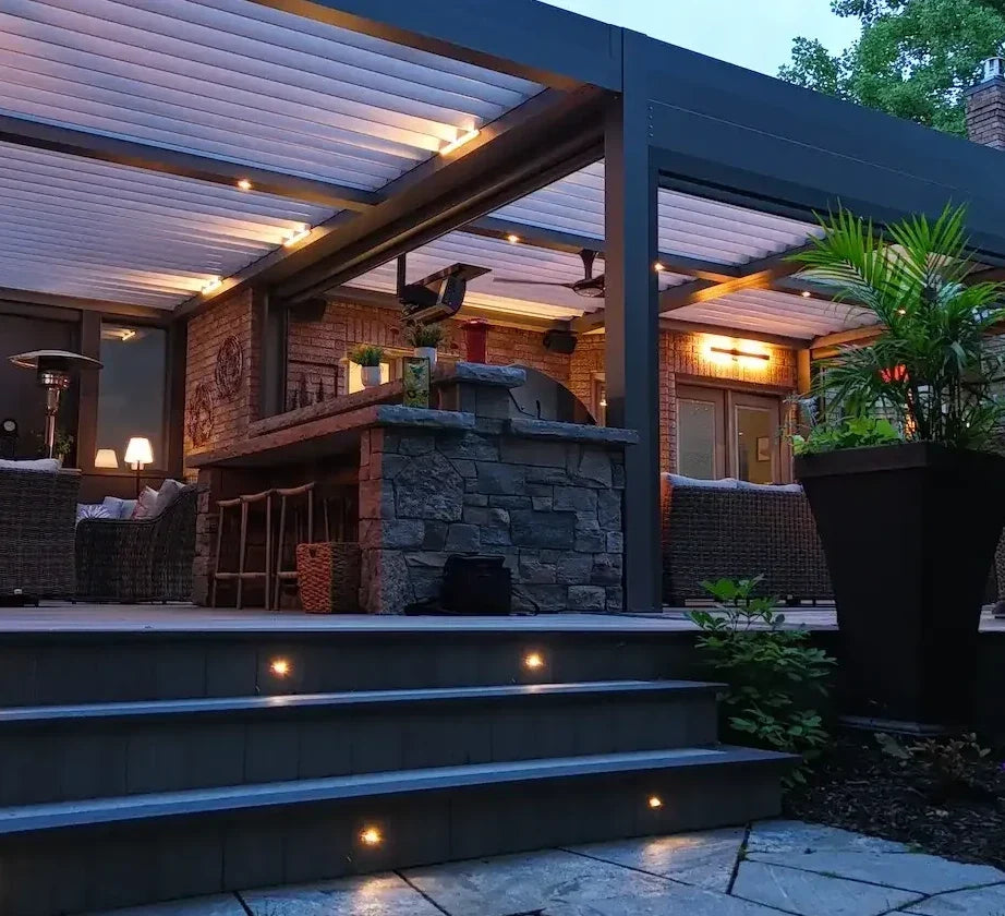 Deck & Landscape Lighting Collection - Integrated stair lights and modern outdoor lighting illuminating a composite deck and patio at dusk