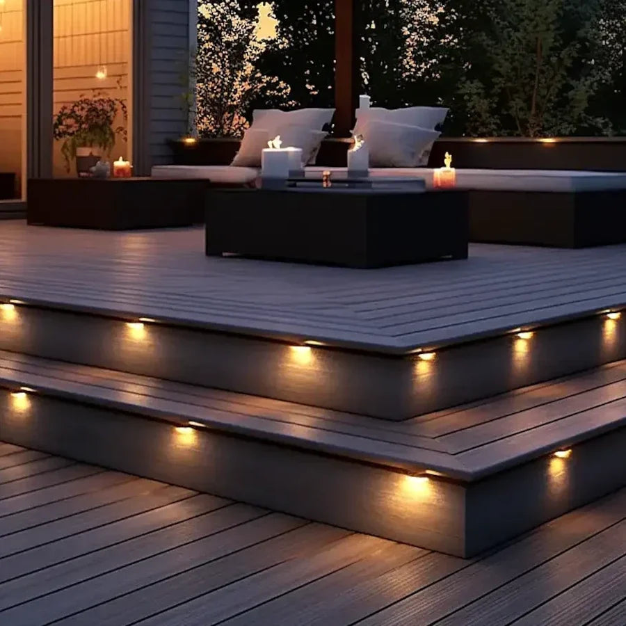 Euro Light Collection - Integrated LED stair riser lights installed on a composite deck stairs at dusk