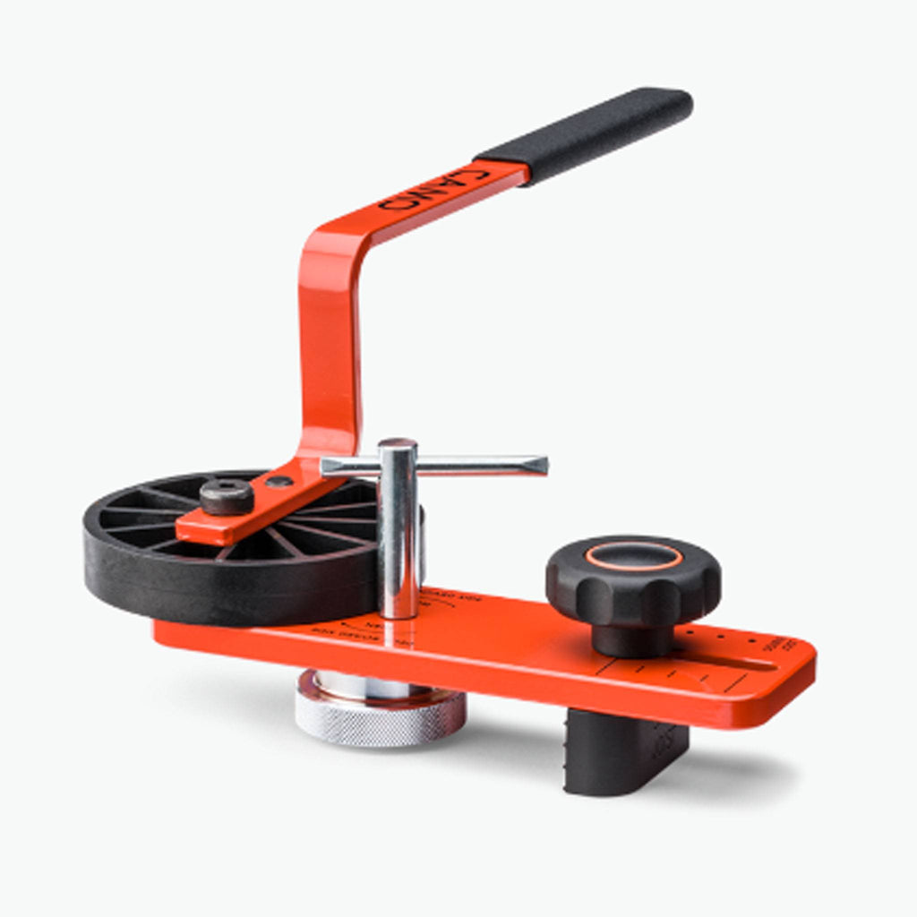 CAMO Lever board straightening tool for locking warped deck boards into place for hands-free fastening.