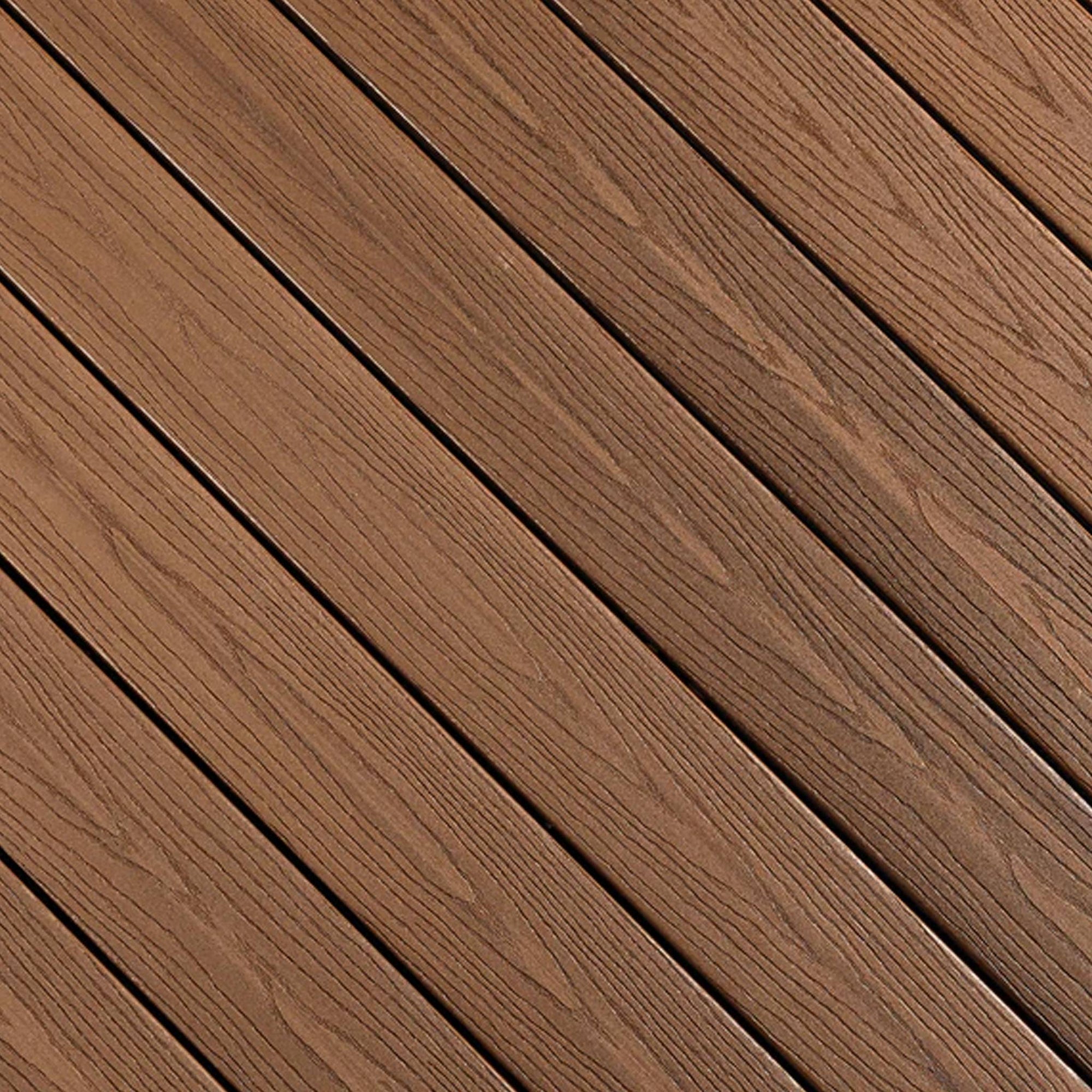 Close-up of Fiberon GoodLife Bungalow composite decking board, showing its multi-tonal earthy brown wood-grain texture and protective cap layer.