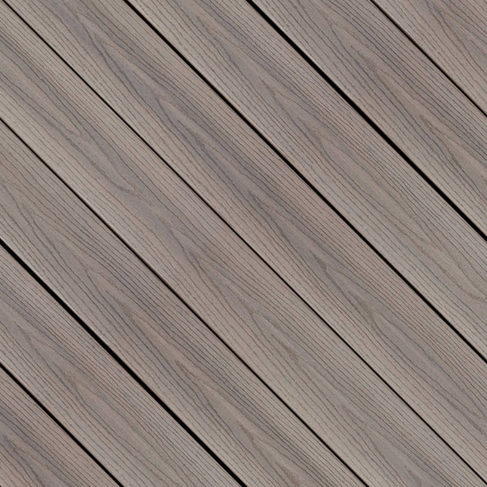 Close-up of Fiberon GoodLife Cabana composite decking board, featuring light sandy wood-grain tones and a protective three-sided cap layer.