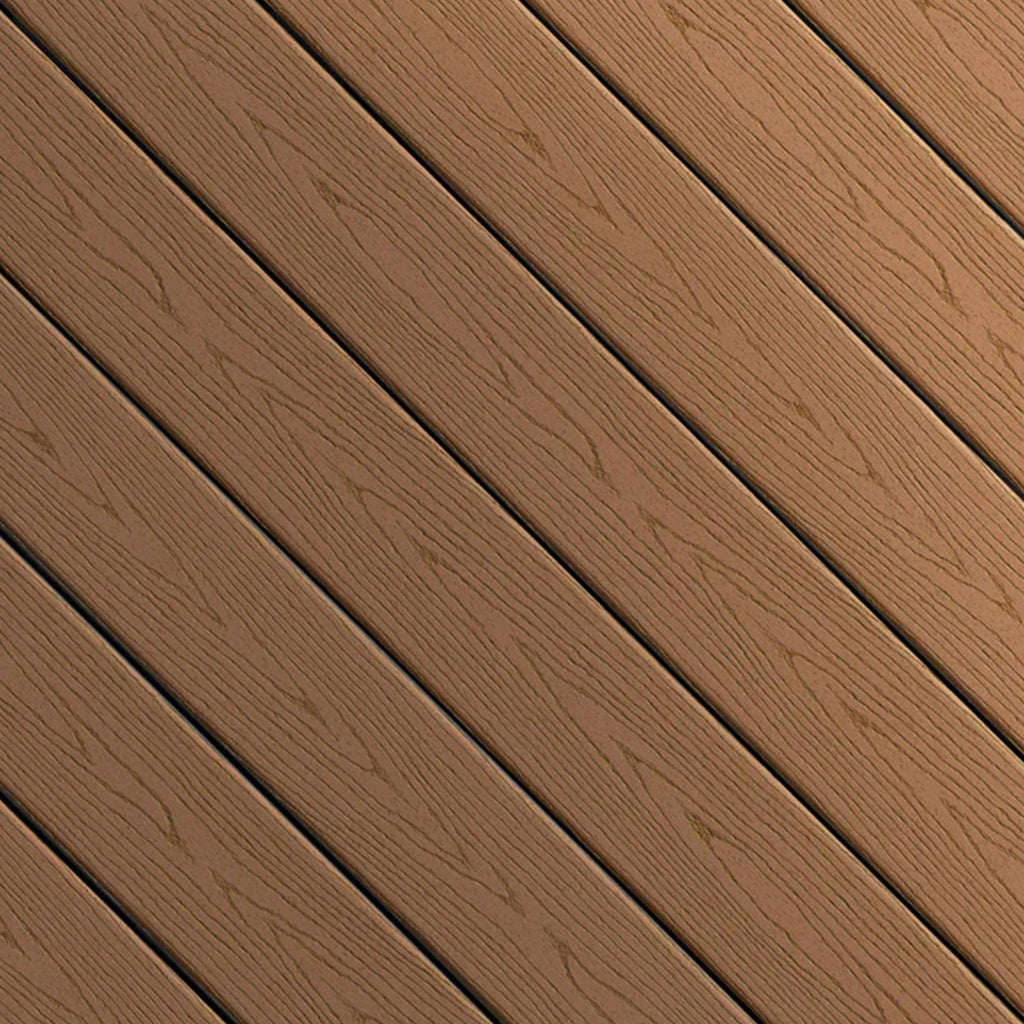 Close-up of Fiberon GoodLife Cabin composite decking board from the Weekender Series, showing its solid chestnut brown wood-grain texture and protective cap.