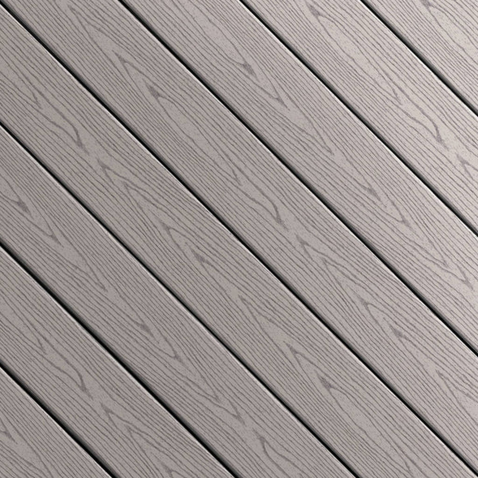 Close-up of Fiberon GoodLife Cottage composite decking board from the Weekender Series, showing its solid gray wood-grain texture and protective cap.