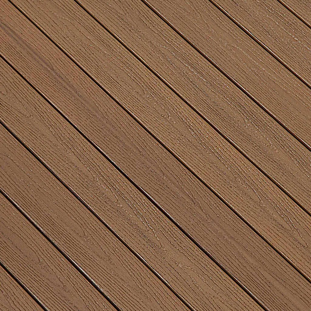 Close-up of Fiberon GoodLife Tuscan Villa composite decking board, showing its rich multi-tonal Mediterranean brown texture and protective cap layer.