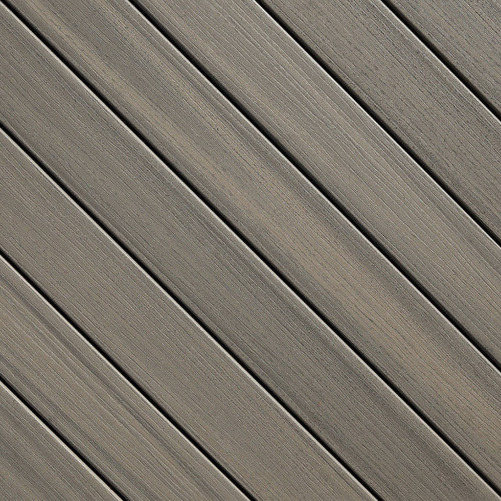 Close-up of Fiberon Paramount Sandstone PVC decking board, showing soft sandy tones and a slip-resistant texture designed for waterfront and pool applications.