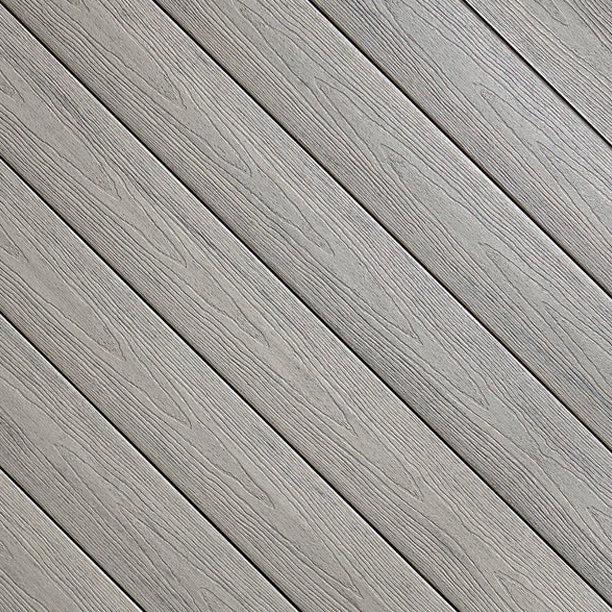 Close-up of Fiberon Sanctuary Chai composite decking, showcasing its warm light-tan multi-tonal grain and rustic embossed surface texture.