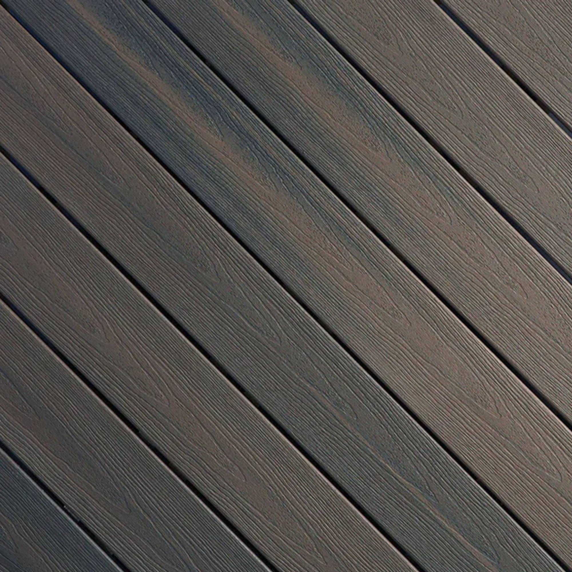 Close-up of Fiberon Sanctuary Latte composite decking, showcasing its warm light-brown multi-tonal grain and rustic embossed surface texture.