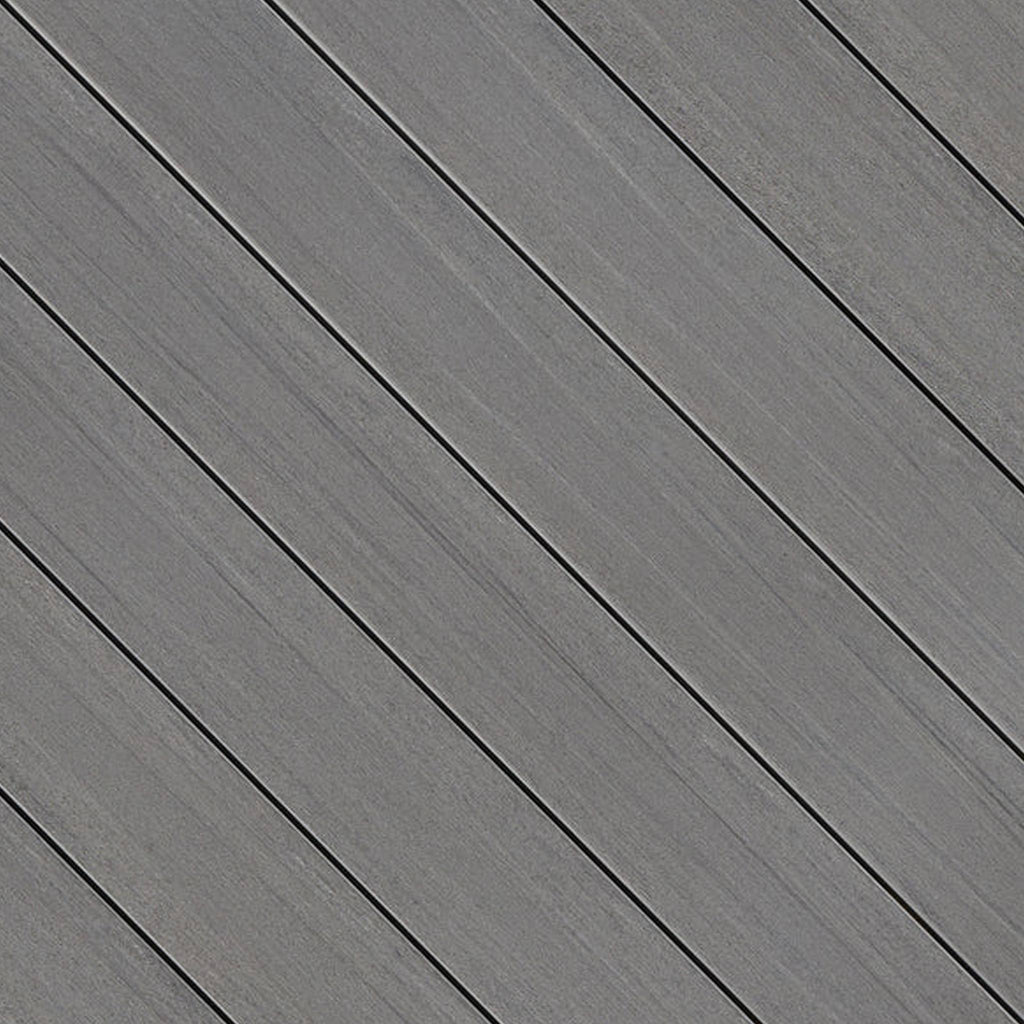 Close-up of Fiberon Promenade Moonlit Cove PVC decking board, featuring deep moonlit gray tones, a matte wood-grain texture, and a slip-resistant surface.
