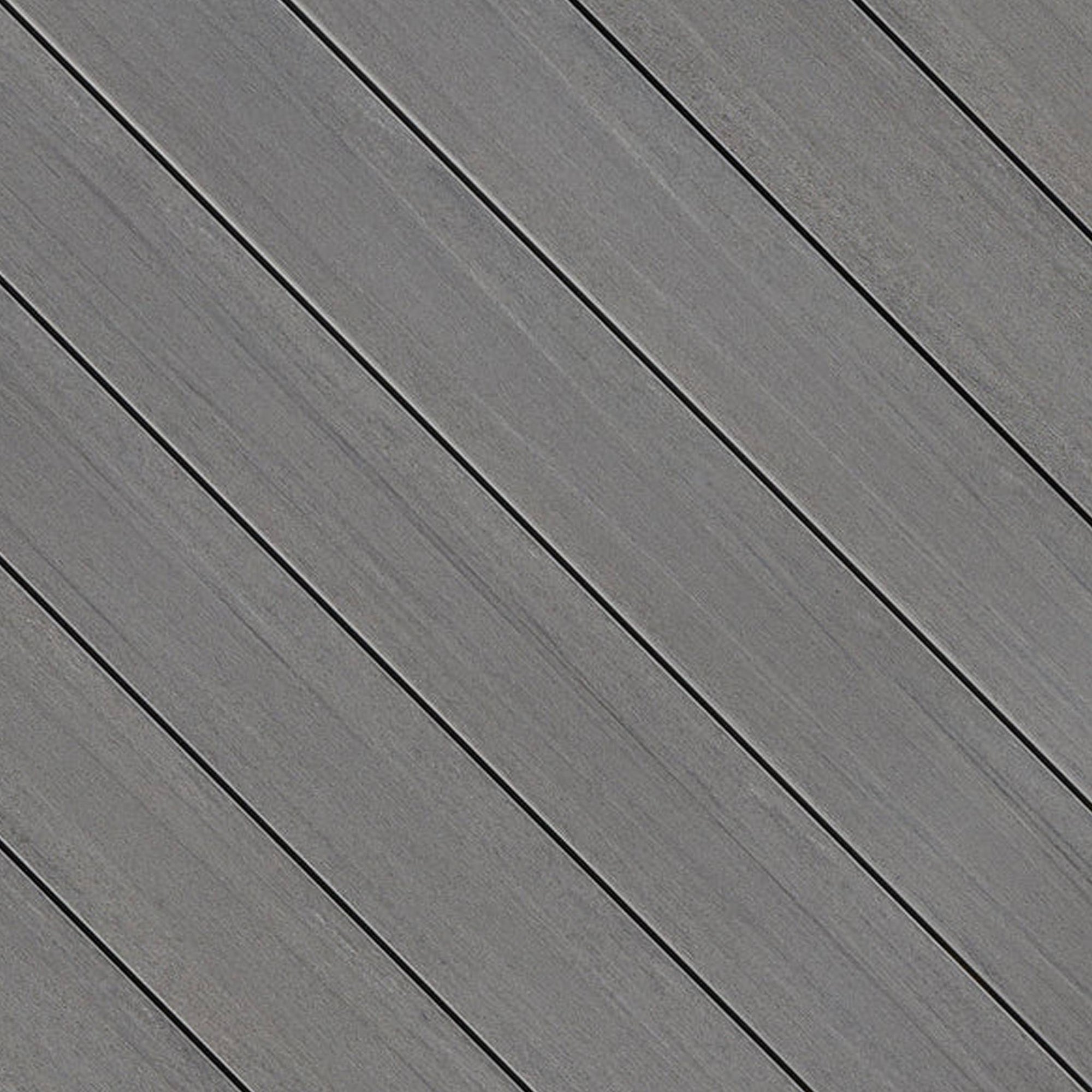 Close-up of Fiberon Promenade Moonlit Cove PVC decking board, featuring deep moonlit gray tones, a matte wood-grain texture, and a slip-resistant surface.