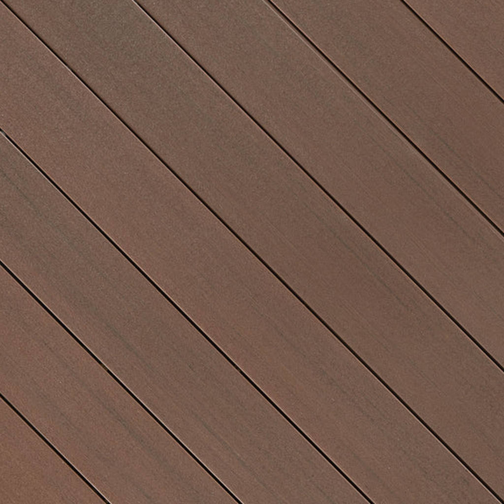 Close-up of Fiberon Promenade Russet Dune PVC decking board, showing its warm russet brown wood-grain texture and premium slip-resistant matte surface.