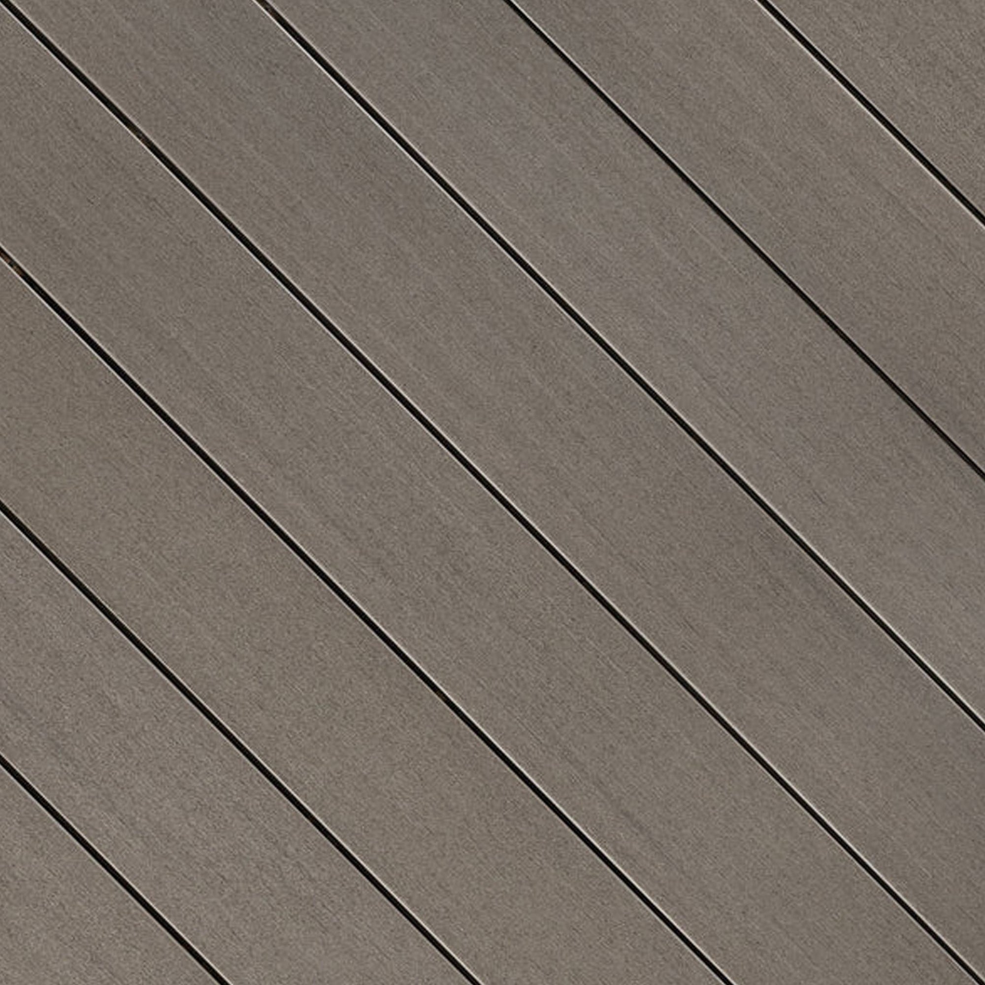 Close-up of Fiberon Promenade Shaded Cay PVC decking board, showing its cool gray wood-grain texture, premium matte finish, and slip-resistant surface.