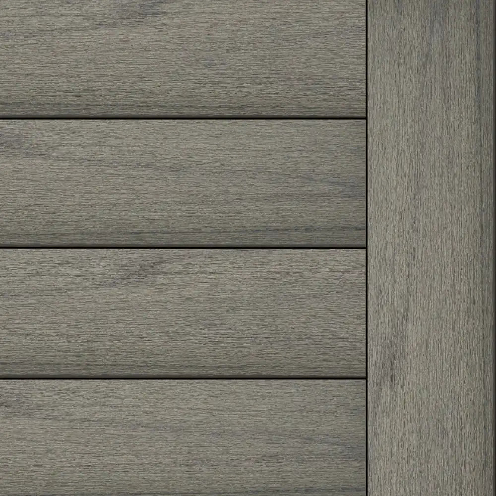 Trex Transcend Lineage Island Mist composite decking with a refined silver-grey wood grain and subtle dark streaks.