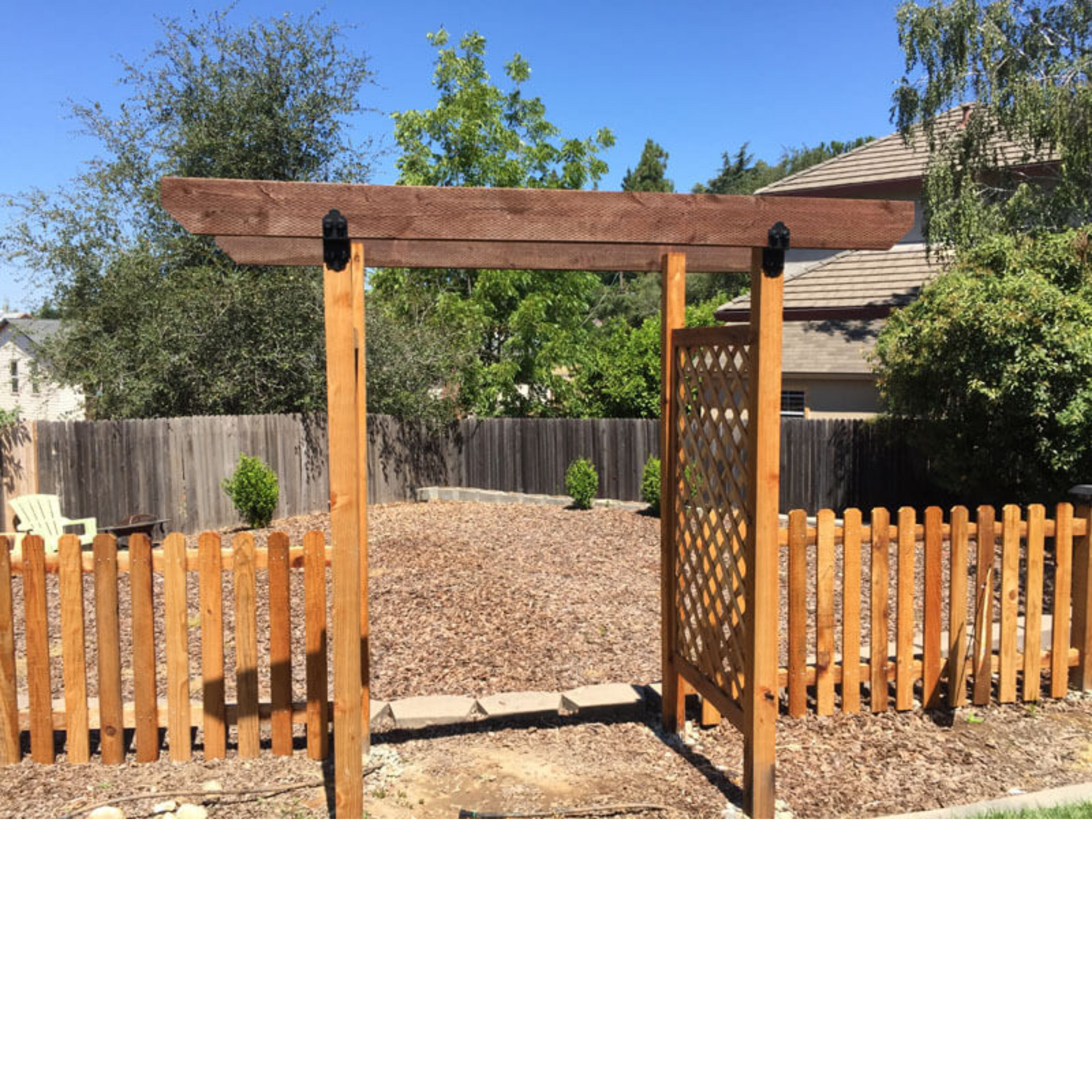 Installed OZCO Laredo Sunset 4-inch post to beam connector on outdoor pergola structure