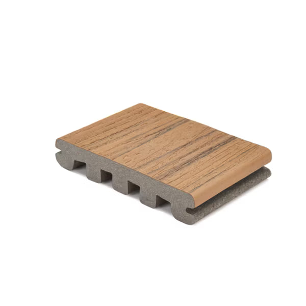 Trex Enhance Naturals Golden Hour grooved composite decking board section with scalloped profile.