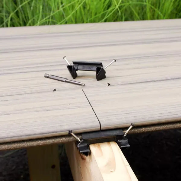 Trex Hideaway Butt Joint Clip securing composite deck board butt joints on a single joist