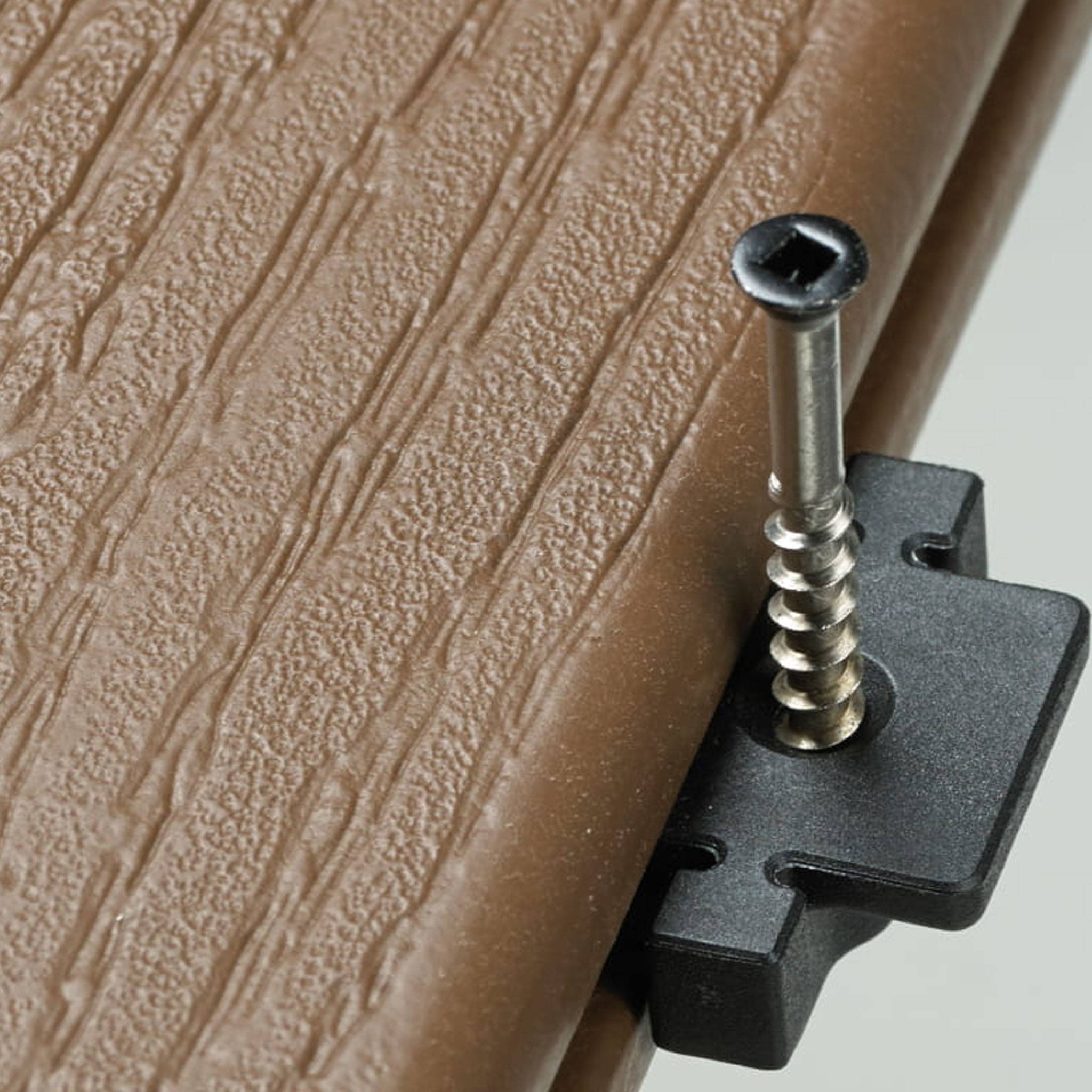 Stowaway hidden fastener in grooved edge deck board