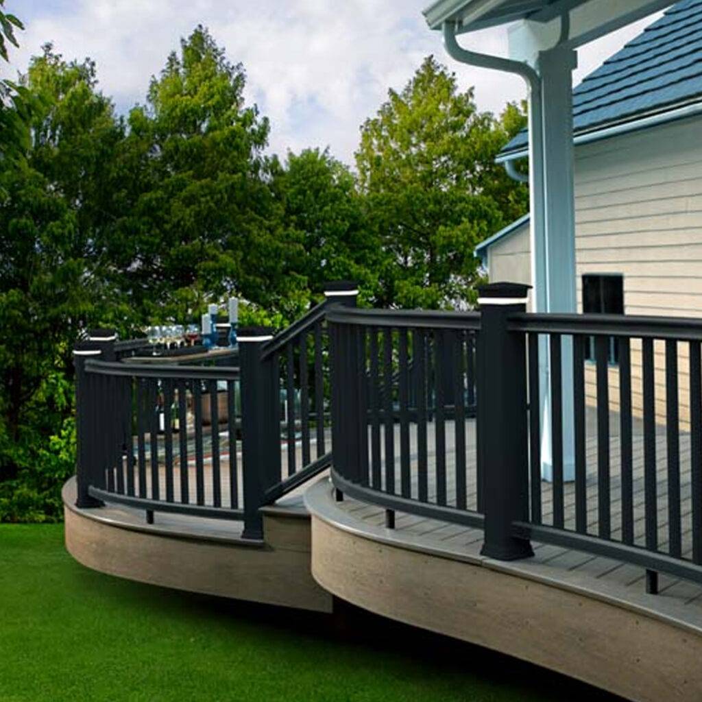 TimberTech Radiance Rail composite railing in black, featuring a smooth, high-end profile with elegant post caps for a refined outdoor space.