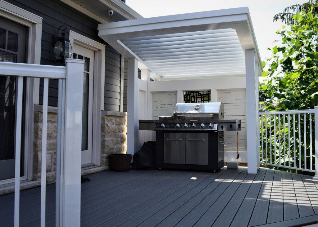 Close-up of Solana panel privacy screens behind a BBQ