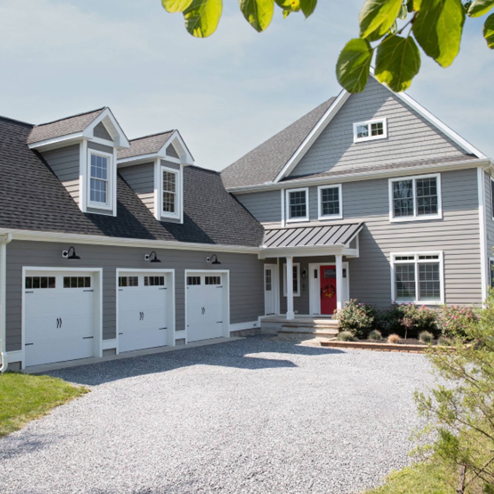 Modern home exterior featuring Royal PVC siding in a sleek, durable finish with a low-maintenance design.