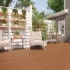 Backyard Deck with Trex Enhance Basics Cinnamon Cove – A cozy outdoor setting featuring Trex Cinnamon Cove decking, a stylish shed, and vertical garden shelving, creating a warm and inviting space.