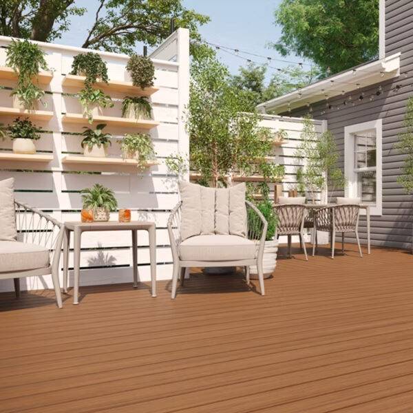 Backyard Deck with Trex Enhance Basics Cinnamon Cove – A cozy outdoor setting featuring Trex Cinnamon Cove decking, a stylish shed, and vertical garden shelving, creating a warm and inviting space.