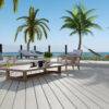 A stylish outdoor deck crafted with Trex Lineage Salt Flat decking, offering a cool, neutral color palette that blends seamlessly with a tropical coastal setting. Features lounge chairs, palm trees, and ocean views, highlighting the decking’s weather-resistant and low-maintenance benefits.