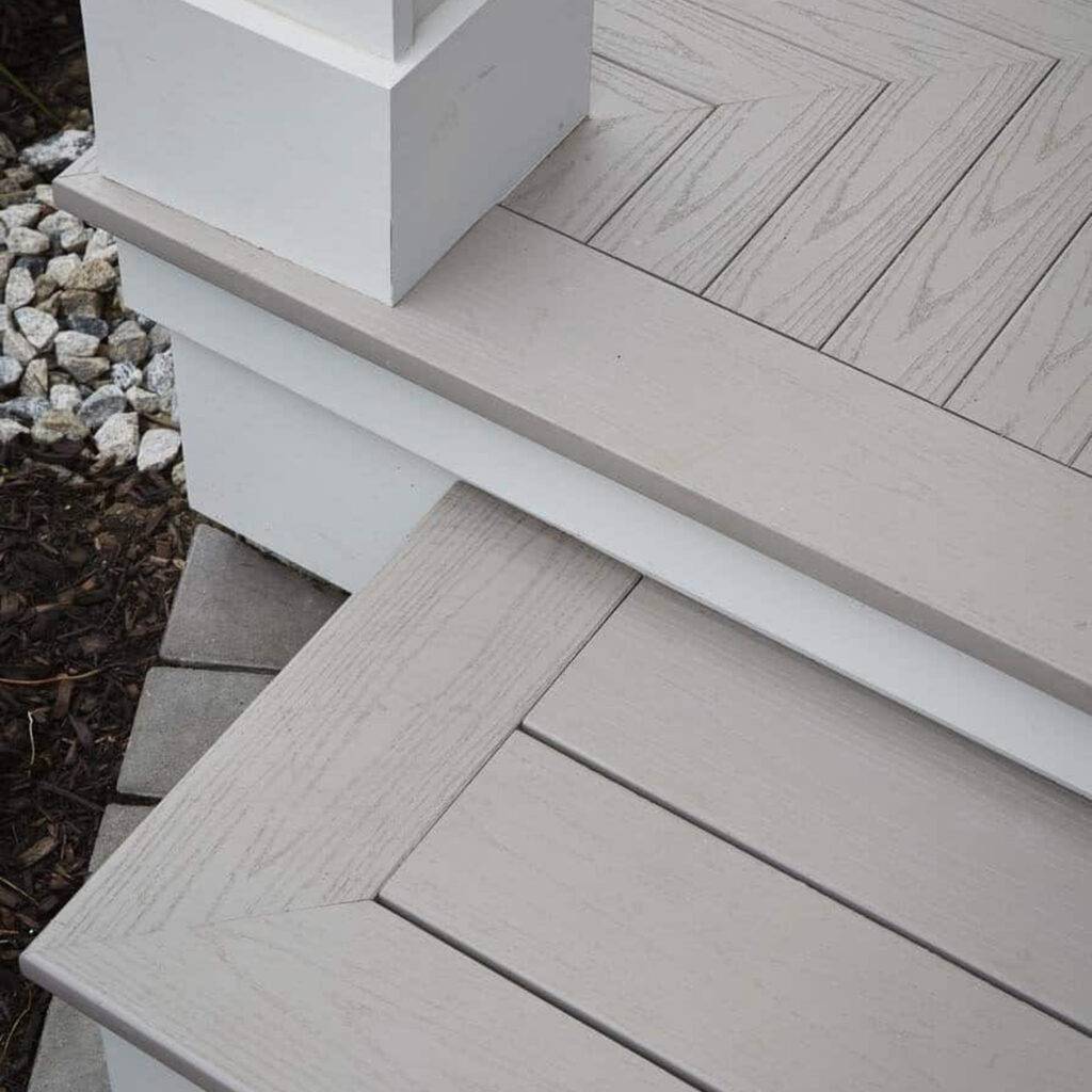 Detailed view of AZEK Porch Slate Gray stair installation with mitered edges