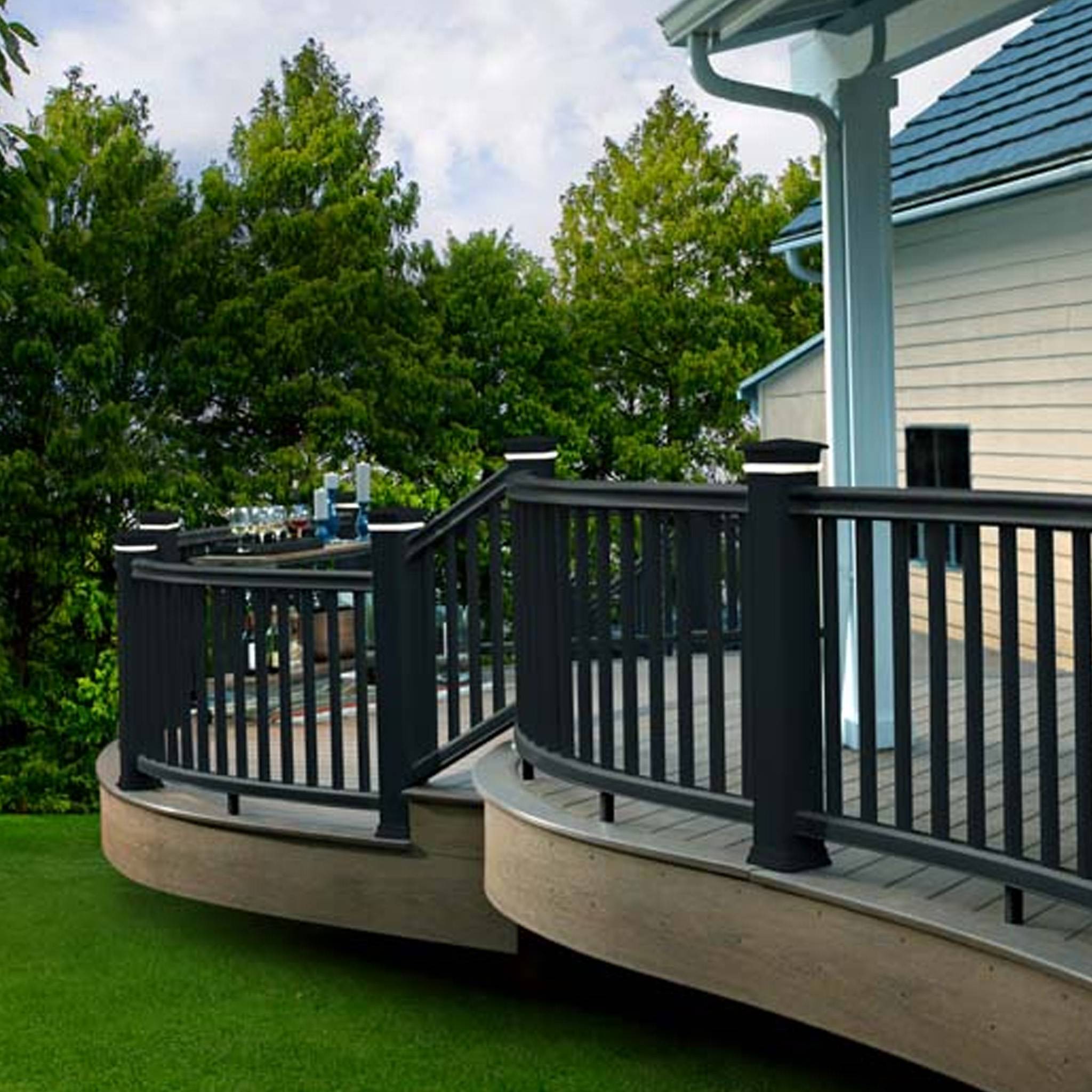 TimberTech Radiance Rail in Black on a curved deck – Stylish and durable composite rail system designed for safety and a sleek modern look.
