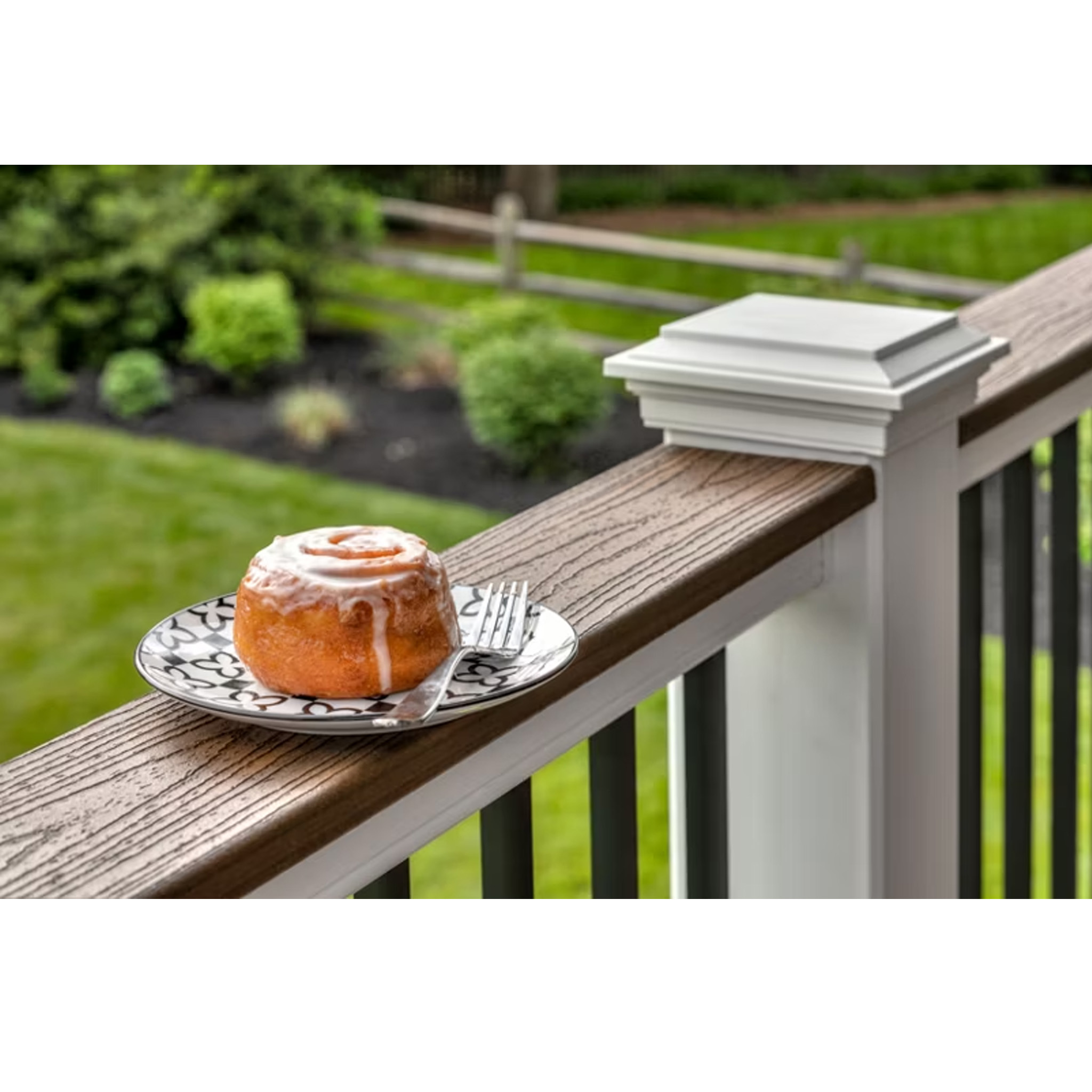 TREX Transcend drink rail in white, topped with a brown composite deck board, serving as a functional ledge
