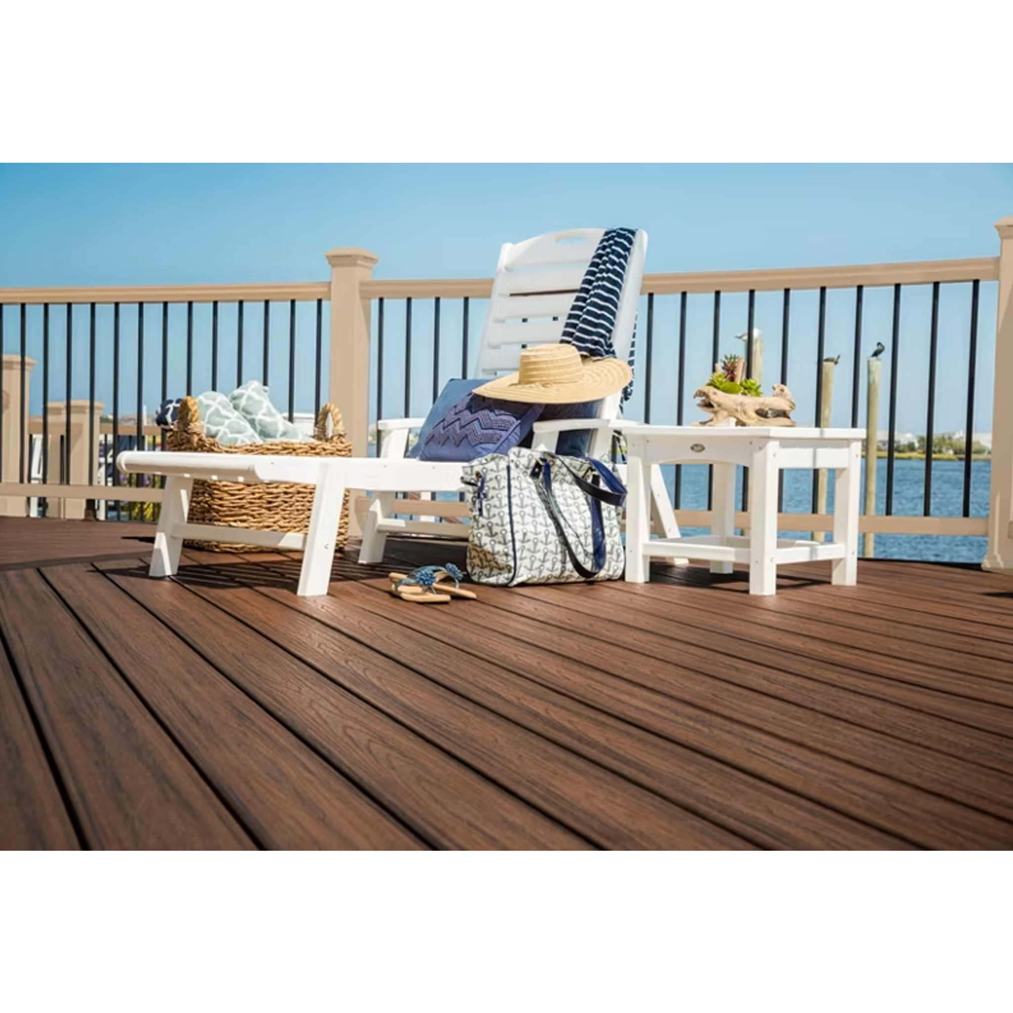 Cozy outdoor seating area featuring TREX Transcend railing in Rope Swing with black balusters.